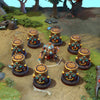 Clockwerk shown in-game wearing the Directive of the Sunbound set. The majestic Aztec-inspired golden helm, dark metal chassis with glowing blue conduits, his transformed Hookshot weapon, and the unique totem-like Power Cogs are clearly visible, showcasing the set's full impact during gameplay.