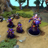 Enigma shown in-game wearing The Arts of Mortal Deception set. The cosmic robes, ornate golden armor, jeweled turban, masked visage of purple energy, and pulsating umbral core are clearly visible, with custom transformed Eidolons making his push even more visually striking.