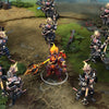 Monkey King shown in-game wearing the Champion of the Fire Lotus set. The intricate headpiece wreathed in perpetual fire, ornate armor with a glowing lotus emblem, massive claw-like greatstaff crackling with fire, and the fiery shoulder familiar are clearly visible, showcasing the set's full intimidating impact.