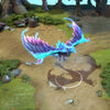 Winter Wyvern in-game wearing the Iceburnt Elegy set from The International 2016 Collector's Cache. The formidable crystalline silhouette, sharp glacial spikes, and luminous wings with their cyan-to-magenta glow are clearly visible, showcasing its full impact.